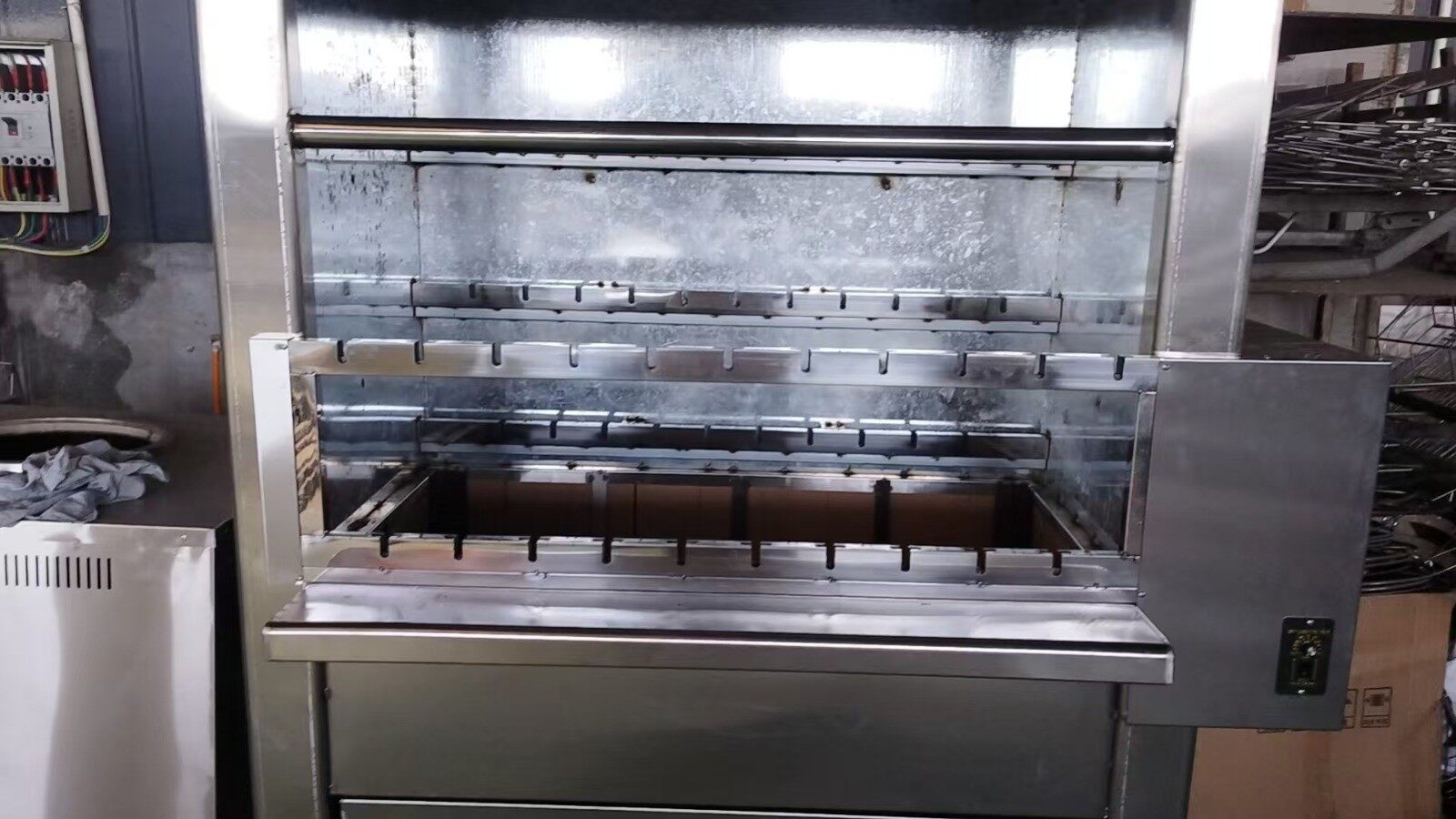 Customized two-level barbecue grill with 21 skewer positions