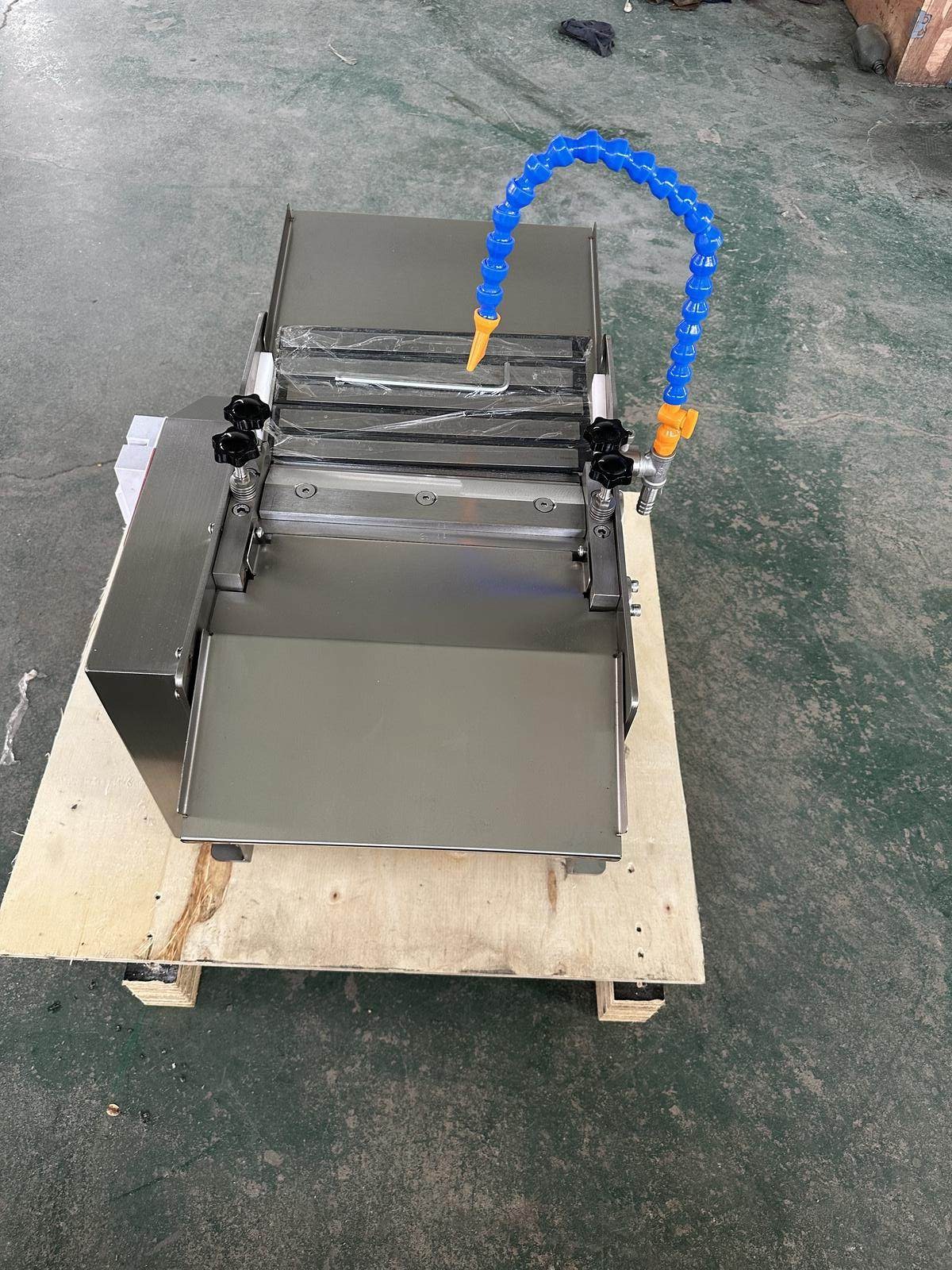 Compact squid peeling machine supplied to a Malaysian seafood processor
