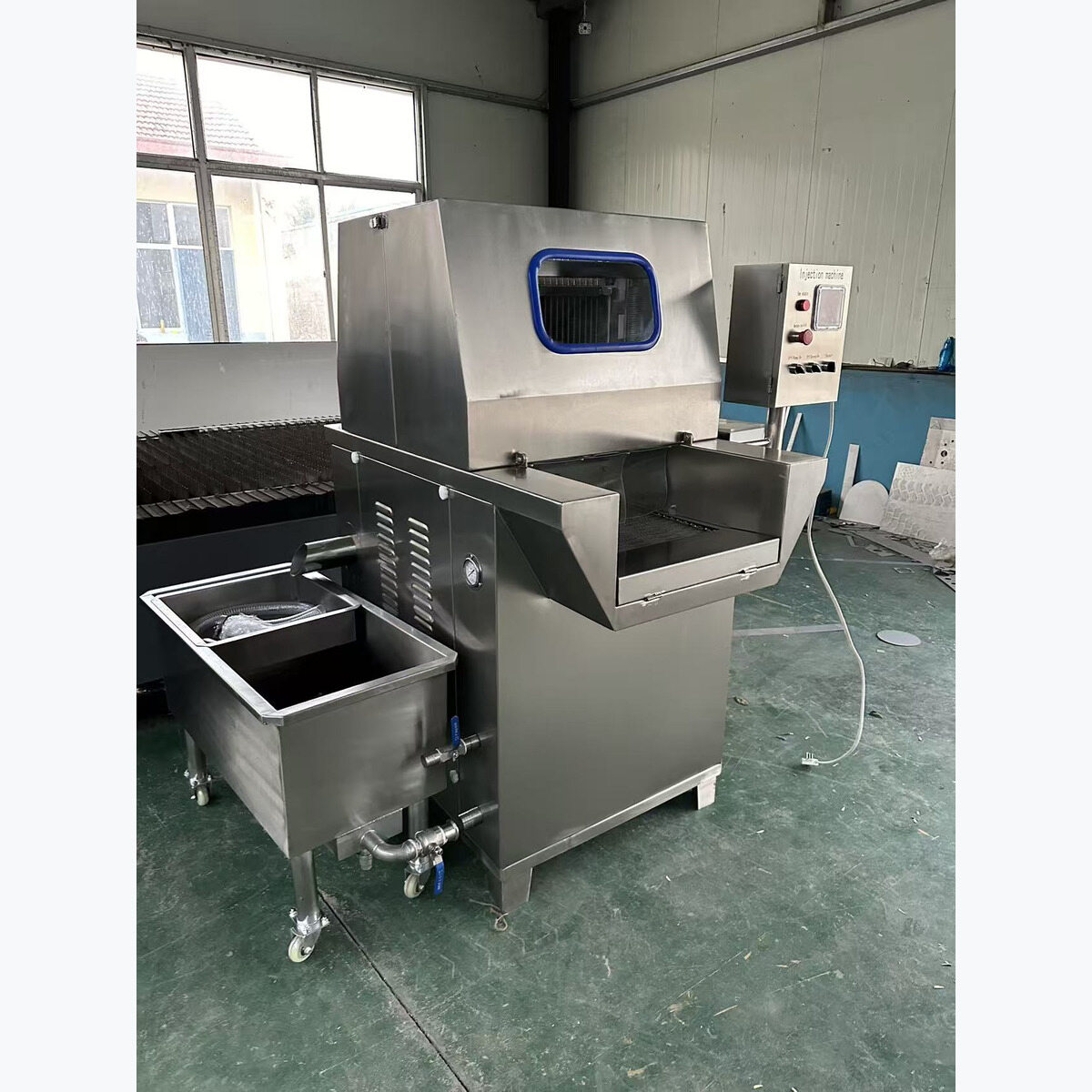 Brine injection machine and liquid trolley in the workshop.