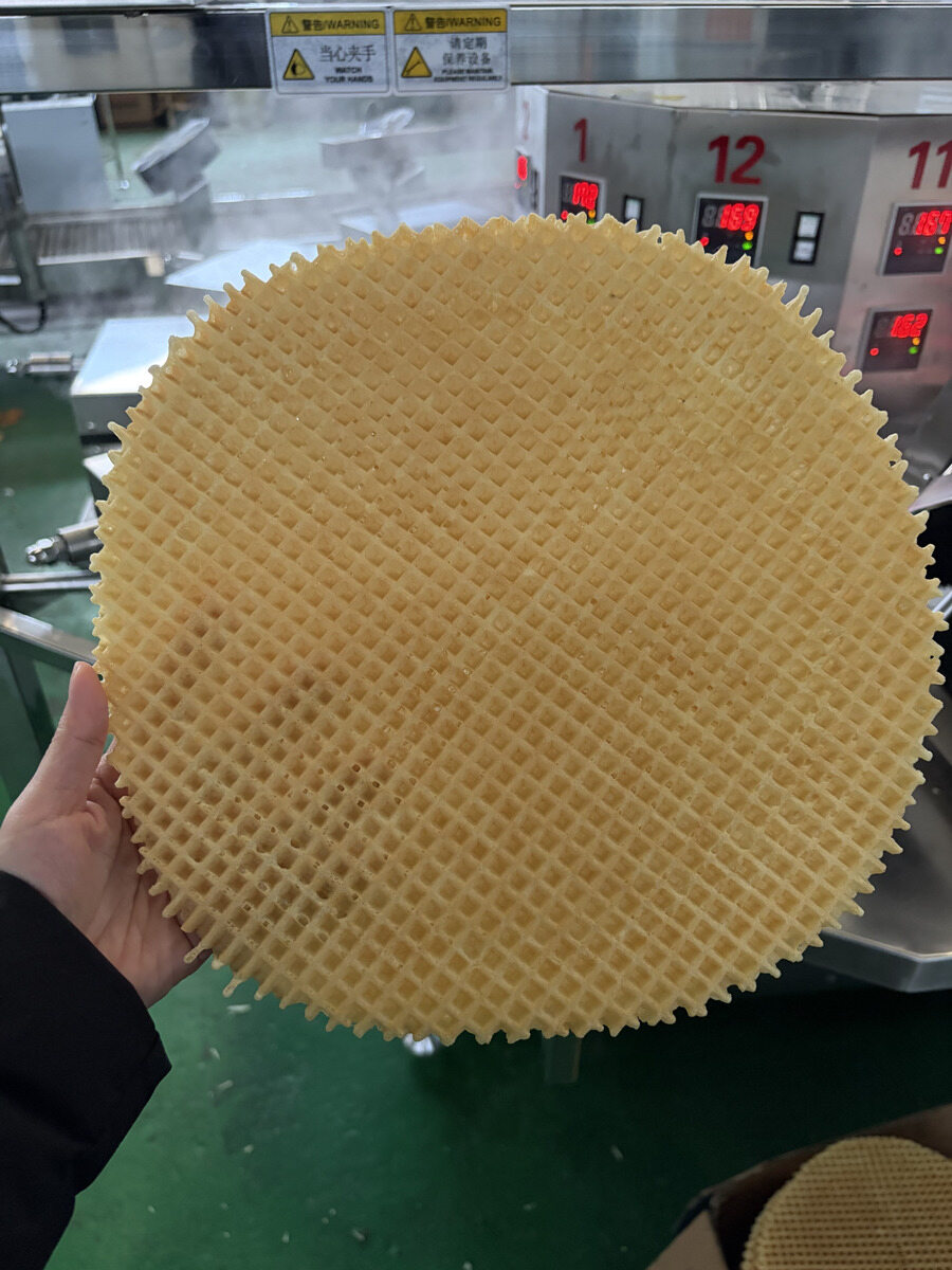 Baked wafer sheet sample shown near the baking machine.
