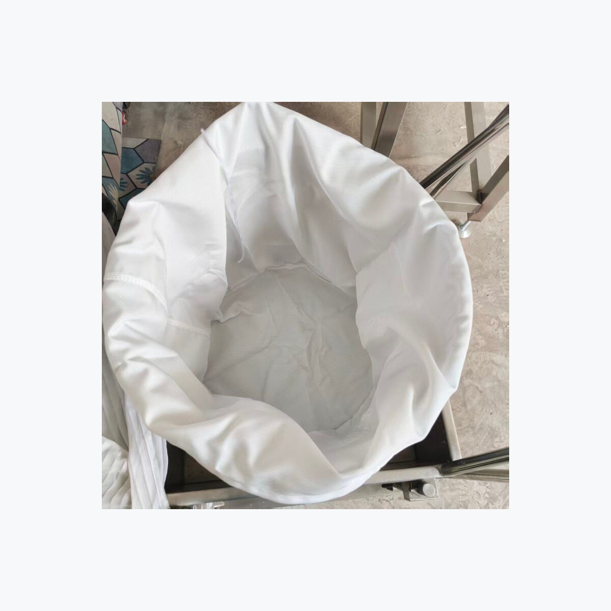 Filter bag fitted inside a pressing basket.