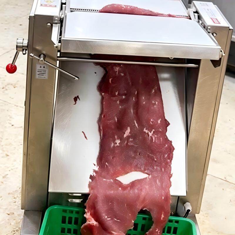 Beef slicing application showing a thin meat sheet at the discharge
