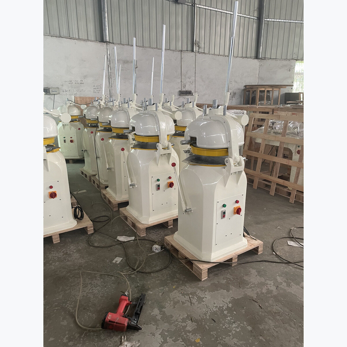 Semi-automatic dough divider and rounder in the workshop.